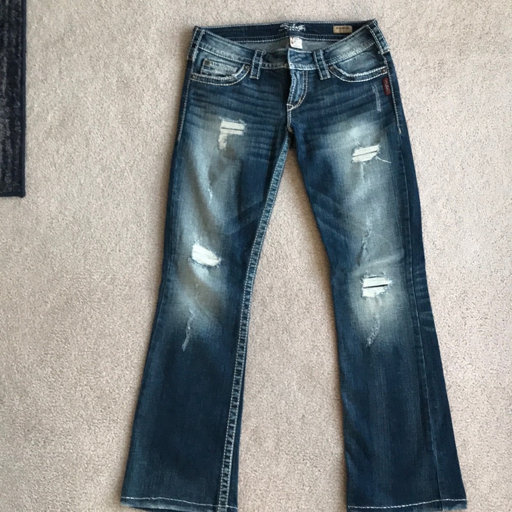 Ripped silver jeans